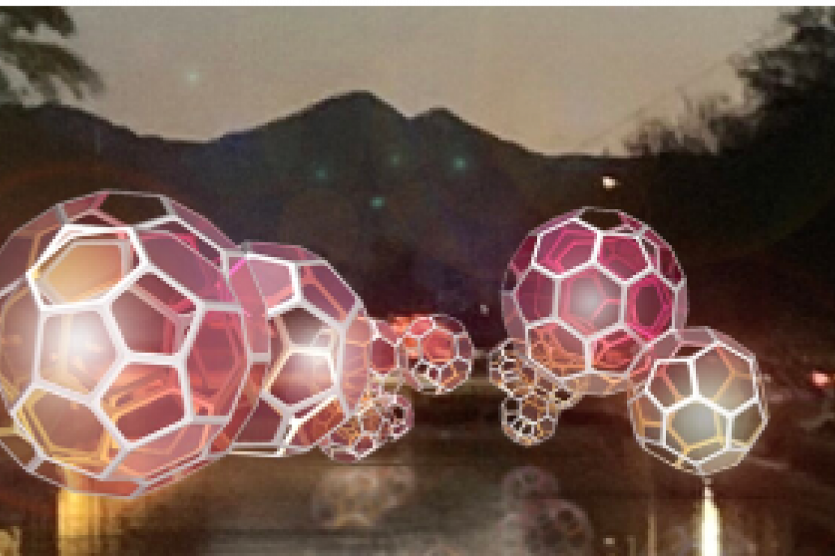 Glowing geometric spheres float above the waterfront canal at night, with mountains and trees in the background at Canal Convergence 2024.