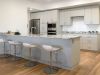 Modern kitchen with white cabinets, granite island, and three white bar stools—perfect for hosting at home on a wooden floor.