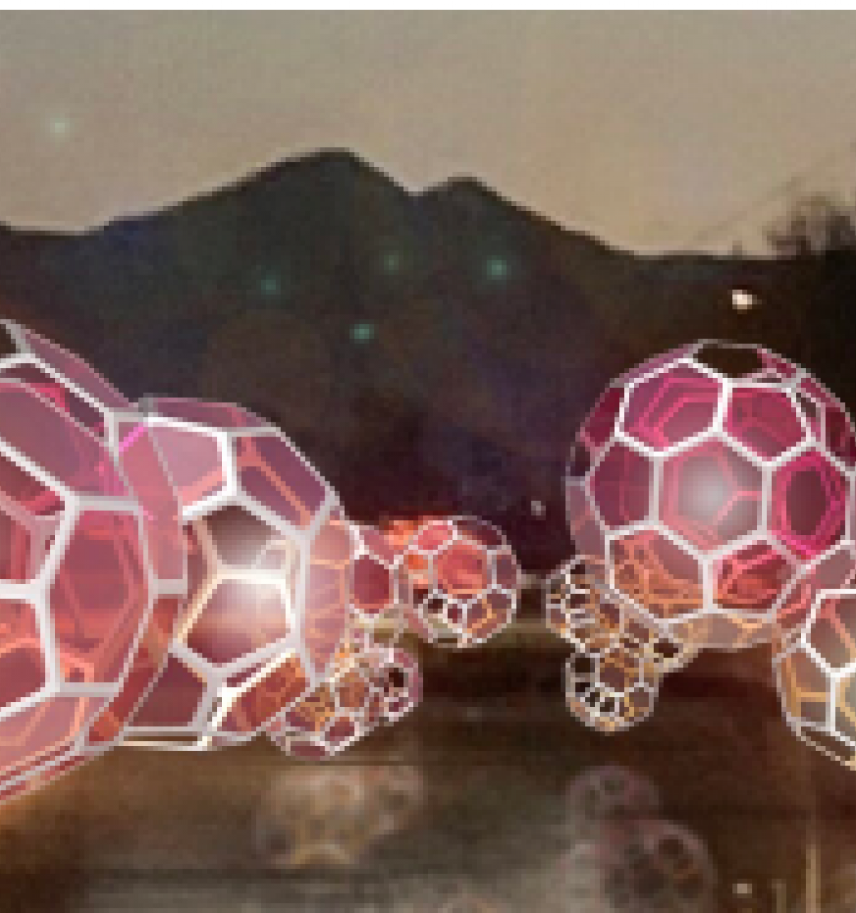 Glowing geometric spheres float above the waterfront canal at night, with mountains and trees in the background at Canal Convergence 2024.
