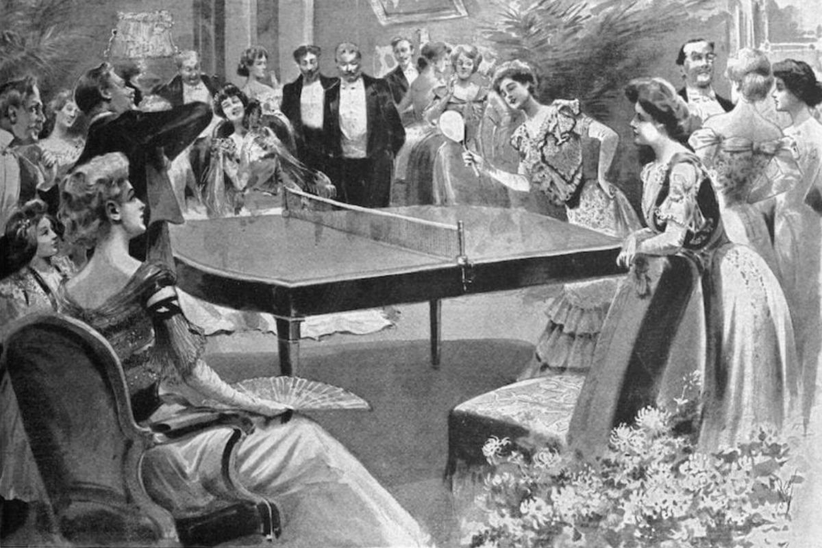Victorian-era party guests in formal attire gather around a grand piano, socializing and discussing the history of Ping-Pong.