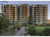 Modern multi-story building with balconies and greenery, ideal for those choosing community within the sought-after Optima Community.