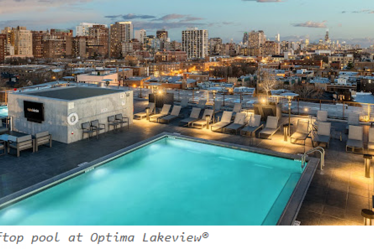 Rooftop pool with lounge chairs overlooking a city skyline at sunset—perfect for adult swimming or relaxing after swim lessons.